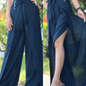 Chic navy blue wrap pants with a tie waist, showcased from different angles to highlight the elegant, flowy design