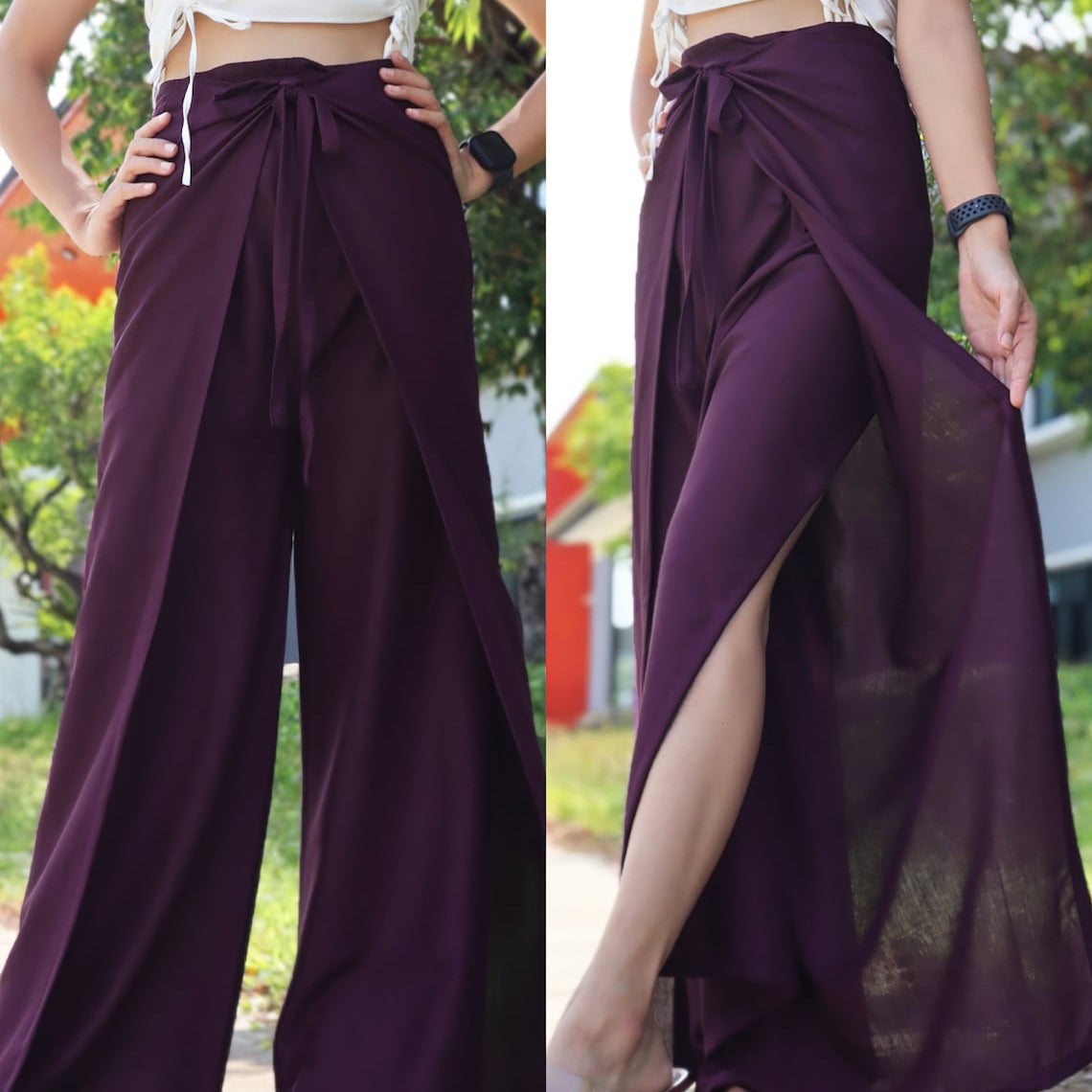 Boho-style deep purple wrap pants with a white cropped top, showcasing the front and side views with a natural outdoor backdrop
