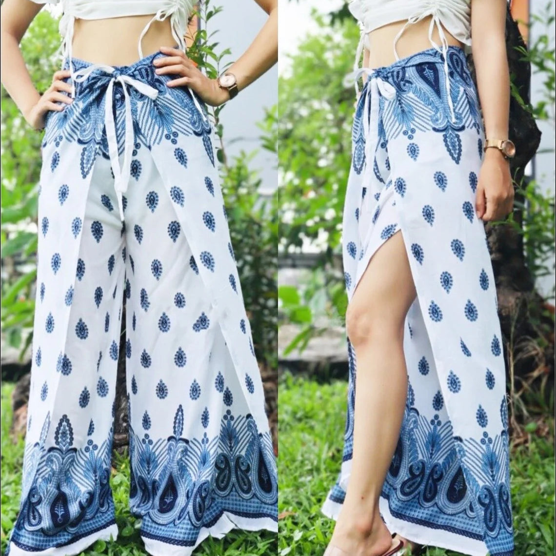 Chic boho wrap pants with a white and blue pattern, showcasing the unique wrap design in a natural outdoor setting.