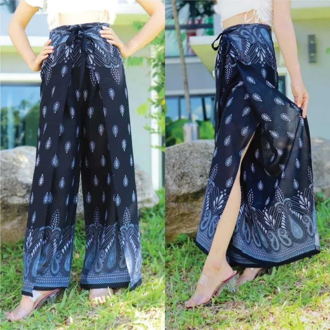 A person is wearing boho black wrap pants adorned with intricate white patterns, showcasing the front and side views against a backdrop of greenery and a building.