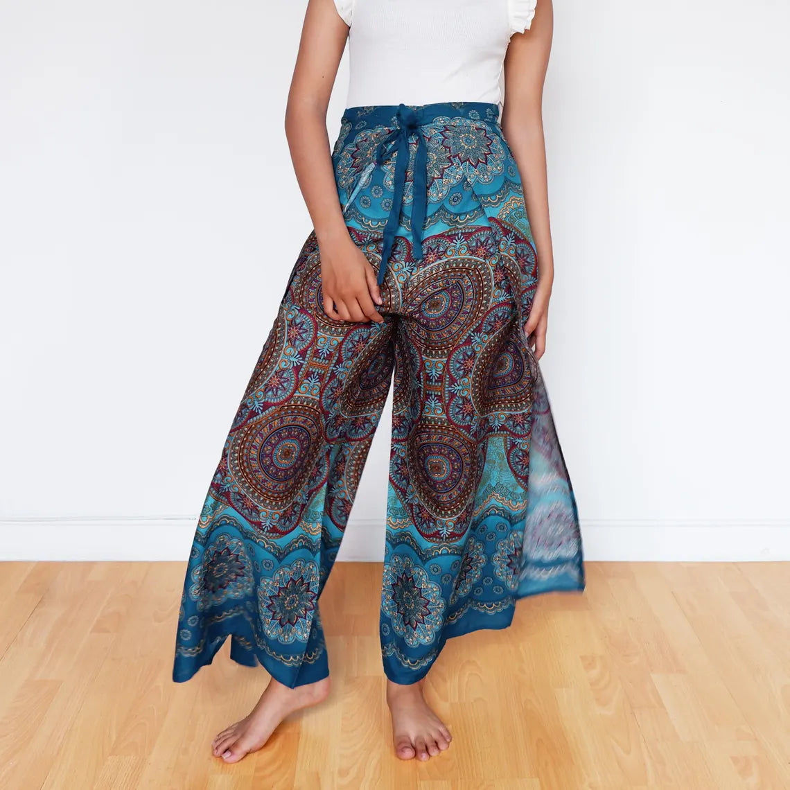 Ocean blue mandala wrap pants styled for a free-spirited bohemian vibe.
