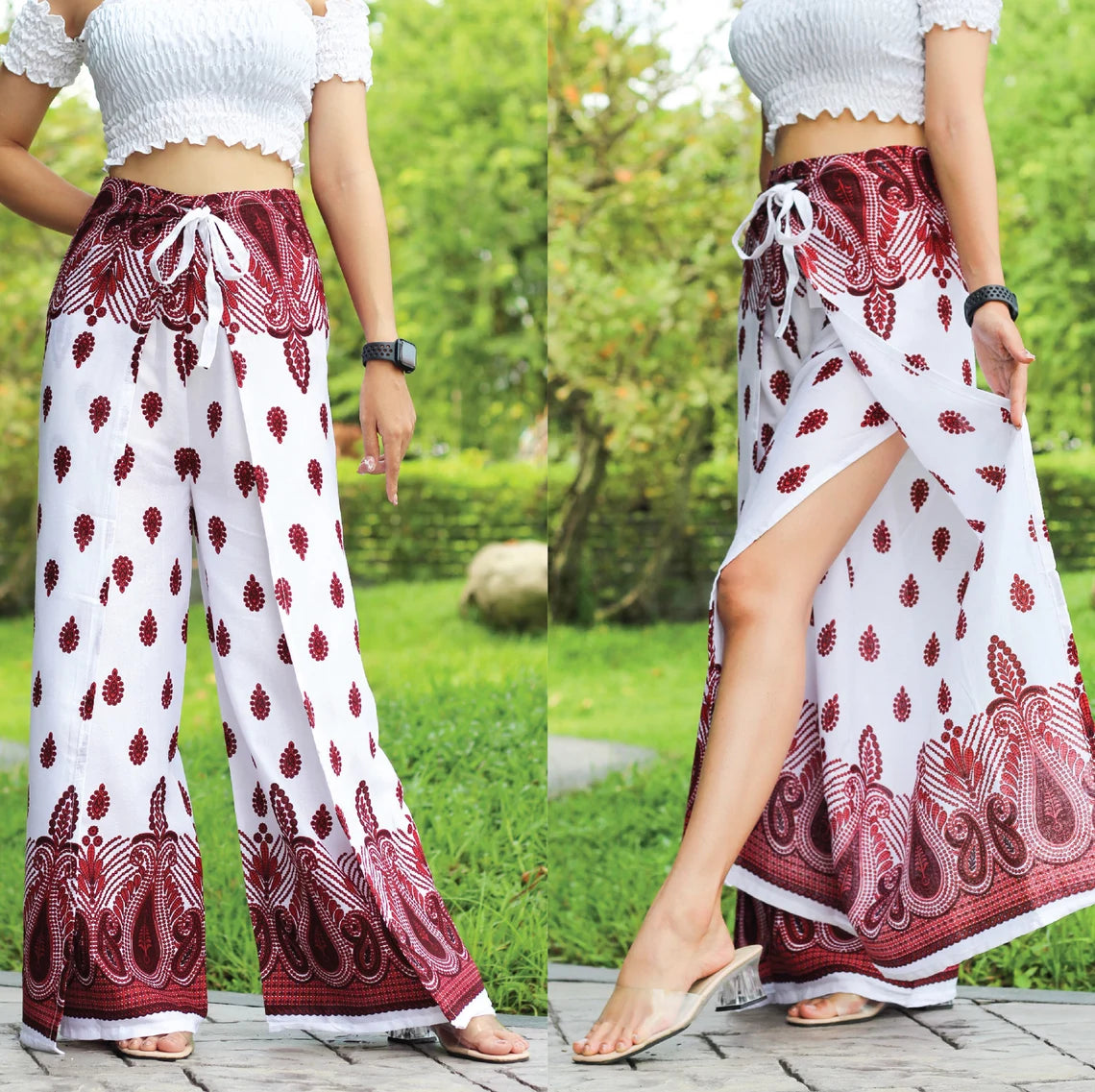 A person wearing boho wrap pants with a white and red pattern, paired with a white top, standing outdoors.