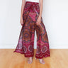 Festival-ready mandala wrap pants in warm sunset pink with earthy tribal accents