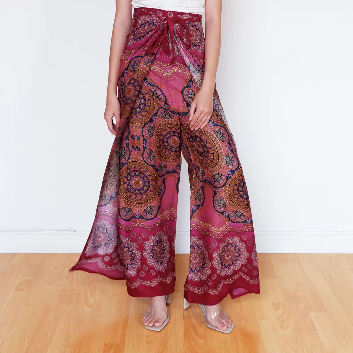 Festival-ready mandala wrap pants in warm sunset pink with earthy tribal accents
