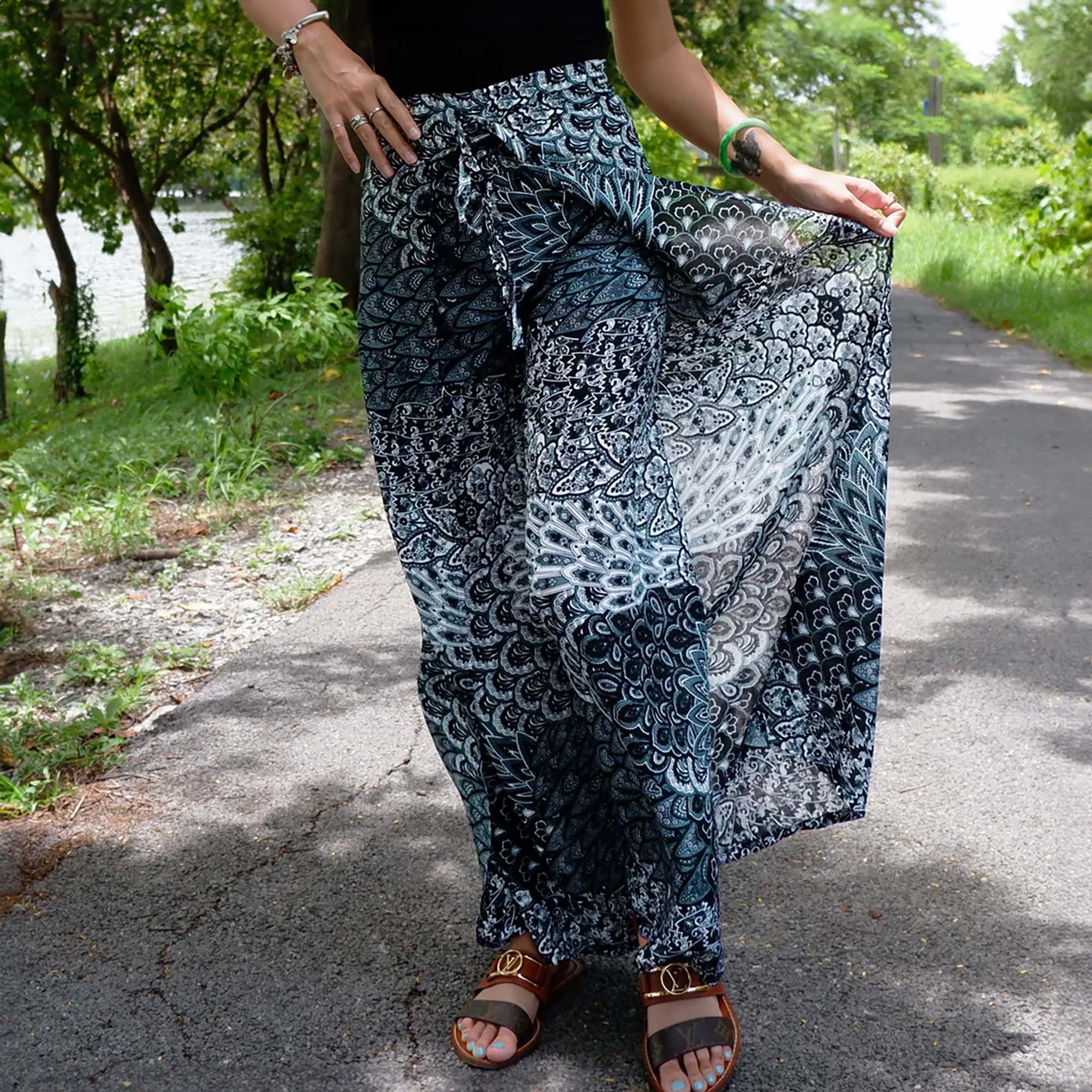Chic boho wrap pants featuring Aegean teal petal print, embodying a relaxed yet fashionable bohemian style.