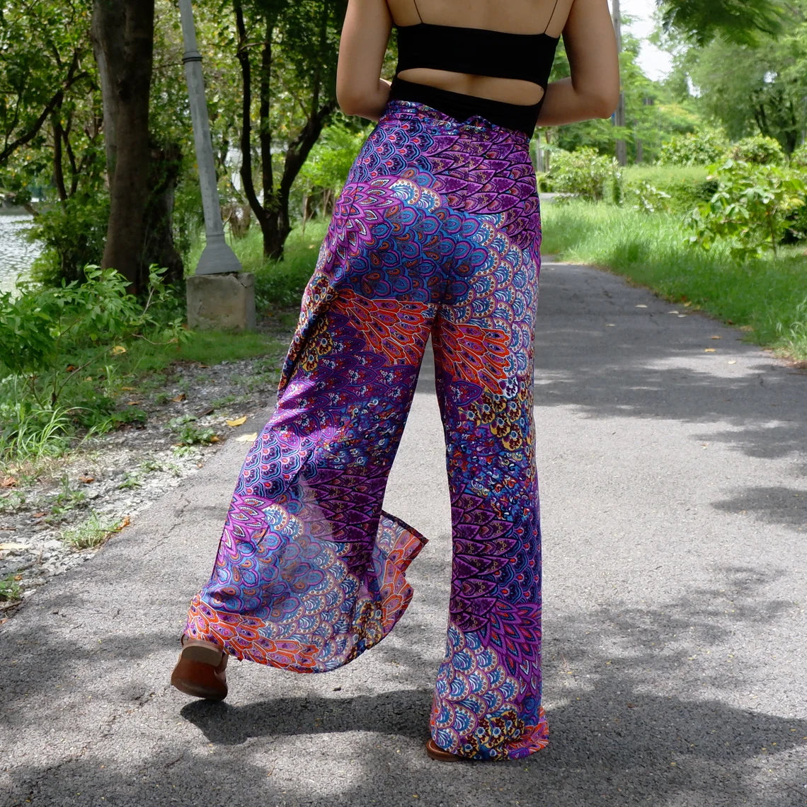 Elegant flowy boho wrap pants with a delicate purple petals print, perfect for a graceful and stylish look.