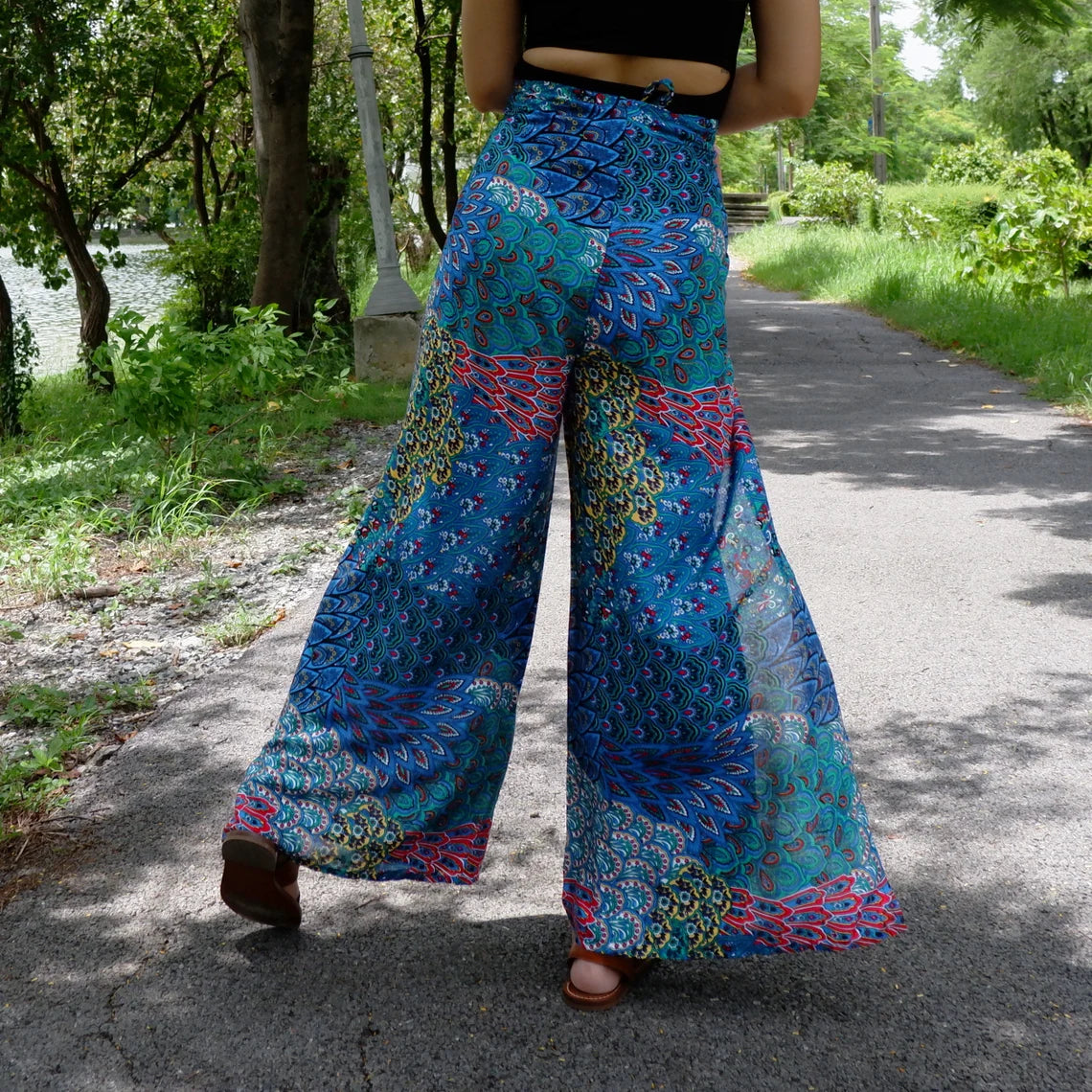 Fashionable boho wrap pants with a striking blue petals print, perfect for a relaxed yet chic look.